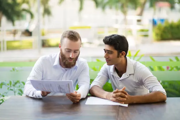 two men discussing differences between acca and dip ifrs course