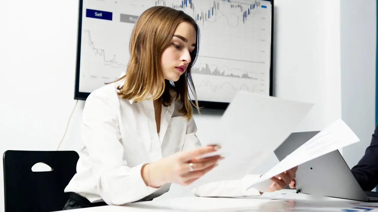 ACCA professional reviewing financial reports and business data