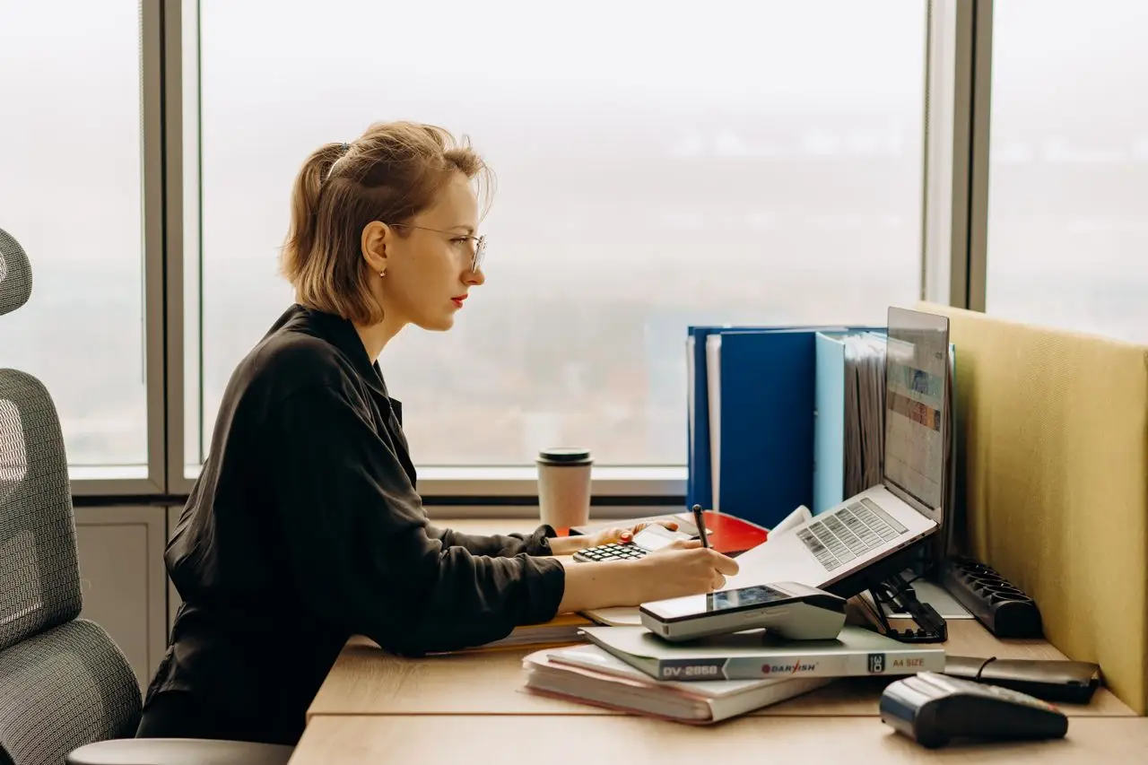 ACCA student updating practical experience records online through laptop